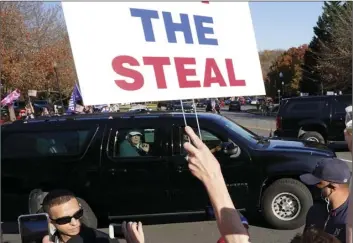  ?? AP PHOTO/STEVE HELBER ?? President Donald Trump looks on to supporters after leaving the Trump National golf club in Sterling, Va., on Saturday.