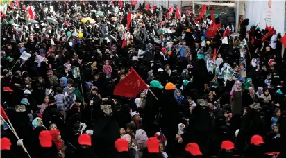  ?? (Reuters) ?? SHIITE HOUTHI WOMEN followers rally yesterday to mark the day of Ashura and the 4th anniversar­y of their takeover of the Yemeni capital, in Sanaa.