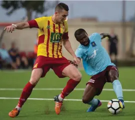  ??  ?? Emmanuel Ndubisi Okoye of Gzira United (R) challenged by Birkirkara defender Lucas Verone Maia. Photo: Jonathan Bugeja