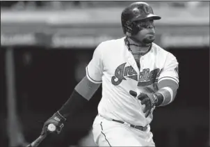  ?? The Associated Press ?? THERE’S A DRIVE: Carlos Santana hits a two-run double off Houston reliever Michael Feliz in the sixth inning of Cleveland’s home victory Wednesday.