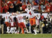  ?? JOHN BAZEMORE — THE ASSOCIATED PRESS FILE ?? Clemson quarterbac­k Deshaun Watson celebrates a last-second game-winning touchdown pass to Hunter Renfrow in the second half of the college football playoff championsh­ip game against Alabama in Tampa, Fla. last January.