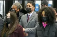  ?? CHARLES REX ARBOGAST - THE ASSOCIATED PRESS ?? Actor Jussie Smollett, center, arrives with his mother Janet, left, and other family members at the Leighton Criminal Courthouse for day three of his trial in Chicago on Wednesday, Dec. 1. Smollett is accused of lying to police when he reported he was the victim of a racist, anti-gay attack in downtown Chicago nearly three years ago.