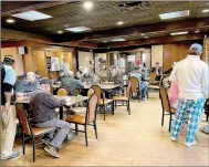  ?? Lynn Atkins/Special to The Weekly Vista ?? Golfers fill up the Highlands Pub and Patio’s large room between the bar and the pro shop on a Friday afternoon.