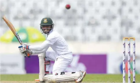  ??  ?? DHAKA: Bangladesh’s Mominul Haque plays a shot during the first day of the second Test cricket match between Bangladesh and England at the Sher-e-Bangla National Cricket Stadium. — AFP