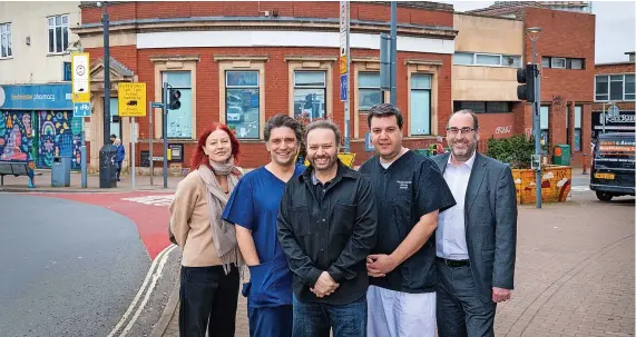  ?? ?? Local councillor­s Christine Townsend (left) and Tony Dyer (right) flank Omega’s dentists, Stefanos Kyriakidis (left) and Konstantin­os Petalotis (right) with developer Tariq Muhammad (centre)