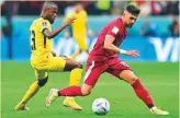  ?? AFP ?? Ecuador’s Enner Valencia (left) fights for the ball with Qatar’s Bassam Al Rawi.