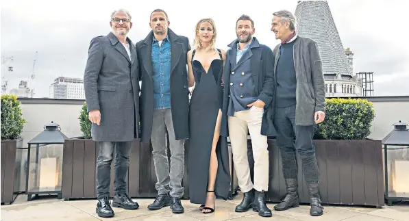  ??  ?? Jennifer Lawrence with, from left, Red Sparrow director Francis Lawrence, and fellow cast members Matthias Schoenaert­s, Joel Edgerton and Jeremy Irons