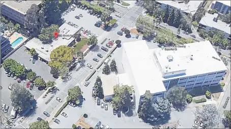  ?? GOOGLE ?? A plan to builld roughly 60 teacher housing units at 231 Grant Ave. in Palo Alto, shown at left in this satellite image, adjacent to the Superior Court building, is gaining steam after the City Council on Monday set aside $3 million toward the units.