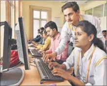  ?? RAJ K RAJ/HT PHOTO ?? Youngsters get training in makeup (top) and computer data entry (above) at a skill developmen­t centre run by Delhi Police at the New Usmanpur police station in the capital.