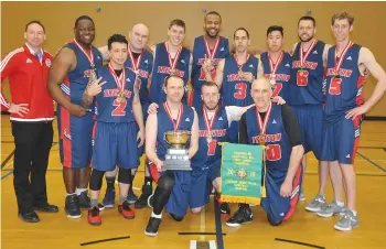  ??  ?? Members of the Canadian Armed Forces national basketball champions from CFB Trenton representi­ng Ontario gather with the championsh­ip trophy.