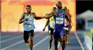  ?? AFP ?? USA’s LaShawn Merritt and Botswana’s Karabo Sibanda run to the finishline in the men’s 4x400 metres relay final at the IAAF World Relays in Nassau. —