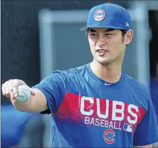  ?? AP PHOTO ?? Chicago Cubs starting pitcher Yu Darvish takes a break from warmup pitches at the team’s spring training facility Tuesday in Mesa, Ariz.