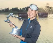  ?? CHINA LPGA ?? Danielle Kang celebrates with the Buick LPGA Shanghai trophy.