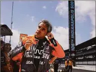  ?? Michael Conroy / Associated Press ?? Juan Pablo Montoya prepares to drive during practice for the Indianapol­is 500.