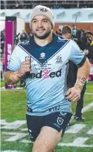 ?? ?? Storm star Brandon Smith runs out for NRL game No.100 against the Sea Eagles on Thursday night.