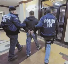  ?? AP FILE PHOTOS ?? ROUNDING THEM UP: ICE agents are seen on the job in New York, above, and Portland, Ore., top.