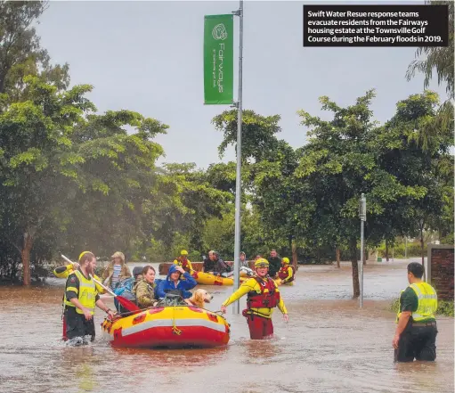  ??  ?? Swift Water Resue response teams evacuate residents from the Fairways housing estate at the Townsville Golf Course during the February floods in 2019.
