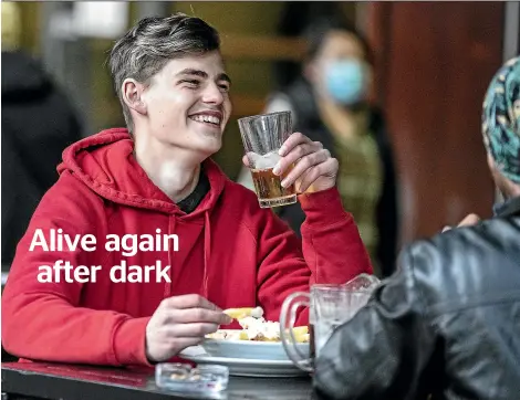  ?? KEVIN STENT/STUFF ?? Finn Price enjoys a first post-lockdown pint out at J J Murphy & Co on Cuba St in Wellington yesterday.