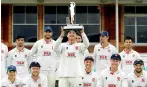  ??  ?? Essex Team celebrates with the Bob Willis Trophy