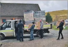  ??  ?? Island Bakery’s Cathy Mellor, pictured here last year with co-worker John Norman, contacted Glasgow food bank Fareshare for help to get donated supplies to Mull.