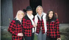  ??  ?? From left, Angela Taggart, Tracy Rait-Parkes, Melissa Kruyne and Angela Singhal, all wearing their barn chic Kott Lumber red plaid jackets.