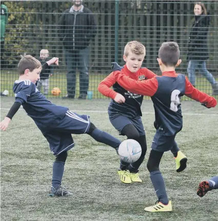  ??  ?? Wrekenton Neu Camp Blues in action against Washington United Yellows (dark blue).