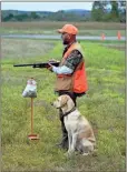  ??  ?? Darrell Morgan of Kingston and his dog Marley prepare to head out for a run to show competitor­s how the Upland competitio­n is done at the Hunter Retriever Club field trials at Kingston Downs Plantation Saturday. / Doug Walker