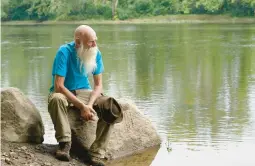  ?? STEVEN SENNE/AP 2021 ?? David Lidstone, known to locals as “River Dave,” had been living for almost three decades in a cabin in the woods along the Merrimack River in Canterbury, N.H.