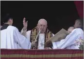  ?? GREGORIO BORGIA – THE ASSOCIATED PRESS ?? Pope Francis delivers the Urbi et Orbi (Latin for `to the city and to the world' ) Christmas Day blessing from the main balcony of St. Peter's Basilica at the Vatican on Sunday.