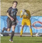  ?? PHOTO COURTESY DON PETERSEN ?? LONE GOAL: Calvin College’s Ian Adams (2) celebrates in front of Brandeis goalie Ben Woodhouse during yesterday’s Div. 3 national semifinal in Roanoke, Va.