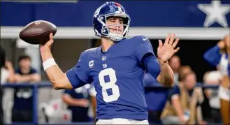  ?? Michael Ainsworth / Associated Press ?? New York Giants quarterbac­k Daniel Jones suffered a concussion last Sunday and remains in the concussion protocol. It’s unlikely he’ll practice Thursday.