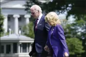 ?? SUSAN WALSH — THE ASSOCIATED PRESS ?? President Joe Biden and first lady Jill Biden walk across the South Lawn of the White House in Washington on Monday after returning from a weekend in Delaware and attending their granddaugh­ter's graduation.
