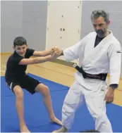  ??  ?? In action Stephen Somerville showing the group some judo techniques