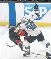  ?? REED SAXON – THE ASSOCIATED PRESS ?? Sharks center Logan Couture (39) and Anaheim defenseman Hampus Lindholm tangle during the first period of Thursday’s Western Conference playoff game.