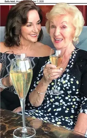  ??  ?? Full of bubbles: Shirley sipping fizz with her mother Audrey yesterday