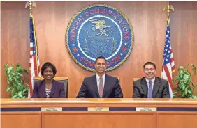  ??  ?? FCC Chairman Ajit Pai, center, with commission­ers Mignon Clyburn, left, and Michael O’Rielly. STEVE BALDERSON FOR THE FCC