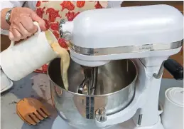  ?? ?? Whipping up a treat: Rose pours the cream into the bowl