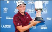  ?? Picture: AAP ?? CUPS AND CAPS: Cameron Smith poses with the trophy after winning the Australian PGA event.