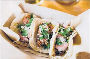  ?? COURTESY OF GRASS & BONE ?? GRASS &amp; BONE will be serving tacos with local meats and vegetables and handmade tortillas at Farm Aid.