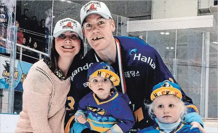  ?? SUBMITTED PHOTO ?? Scott Barney celebrates an Asian Hockey League Championsh­ip with Anyang Halla with his family, from left, wife Tara, his son Jack and daughter Charlie. Barney has joined the Humboldt Broncos as an assistant coach.