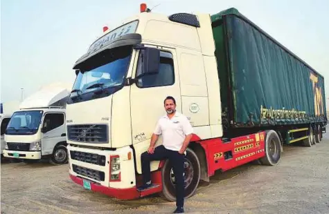  ?? Arshad Ali/Gulf News ?? Naseer Ahmad, director of Truxapp in Dubai. Truxapp doesn’t own or operate any of the listed trucking services; instead these are all independen­t owners with cargo space to offer on their vehicles.
