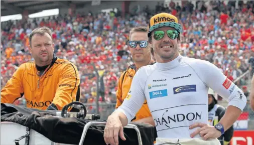  ??  ?? Fernando Alonso, con la escudería McLaren, en la parrilla de salida del GP de Alemania de 2018, disputado en el circuito de Hockenheim.