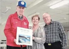  ?? LAURA BARTON THE WELLAND TRIBUNE ?? Robert Wood, left, founder of The Robert Wood Singers, holds up one of the various albums the choral group has recorded over the years. He stands with current director Deanna Schaus and original member Brian White. Next month, the group is celebratin­g its 50th anniversar­y.