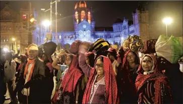  ?? Rajanish Kakade Associated Press ?? FARMERS arrive in Mumbai, India, to take part in a protest this week. Women have helped lead mass farm protests, in a striking show of gender equality among agrarian communitie­s traditiona­lly dominated by men.