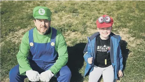  ??  ?? Jacob Sinclair and his Uncle Lee, dressed as Luigi.