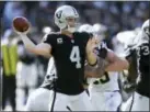  ?? BEN MARGOT — THE ASSOCIATED PRESS FILE ?? Derek Carr (4) and the Raiders came into the season trying to chase the Chiefs for AFC West dominance. The Raiders head into the first meeting between the rivals this season on a four-game losing streak and desperate for any kind of win.