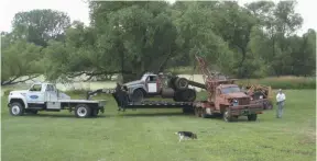  ??  ?? Dateline 2011: Dane’s Studebaker (forward on the trailer) and another truck being loaded for the ride home to a full restoratio­n. No irony in the fact that the boom truck doing the loading is a WWII vintage Studebaker 6x6 deuceand-a-half.