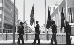  ?? KRISTEN ZEIS/ THE VIRGINIAN-PILOT ?? The City of Newport News United Honor Guard presents the colors during the Juneteenth Raising of the Flag ceremony at Newport News City Hall in 2021.