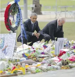  ?? PABLO MARTINEZ MONSIVAIS / THE ASSOCIATED PRESS ?? President Barack Obama and Vice-President Joe Biden visit a memorial to the Orlando victims on Thursday.