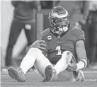  ?? MATT SLOCUM/AP ?? Eagles quarterbac­k Jalen Hurts reacts after being sacked during Sunday’s game against the Cardinals.